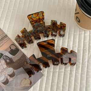 French minimalist tortoise shell acetate hair claws with elegant gold print detail