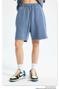 Detail of retro washed dark blue cotton knit shorts with adjustable drawstring waist