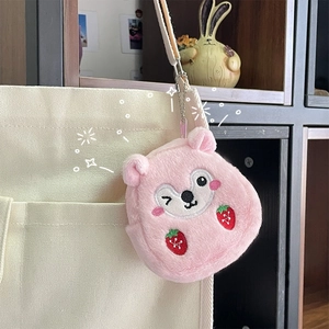 Detailed view of pink plush bear coin purse with strawberry embroidery and keychain