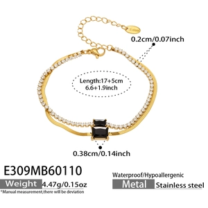 Detail of double-layer stainless steel gold bracelet with black gem and tennis chain