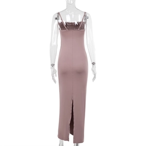 Detailed back view of a slim-fit knitted midi dress with thin straps and a center back slit