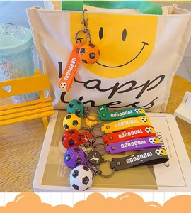 Colorful soccer ball keychains with GOOOOAL silicone wrist straps and metal ring