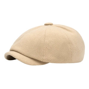 Classic beige wool blend newsboy hat with curved brim and textured finish on white background