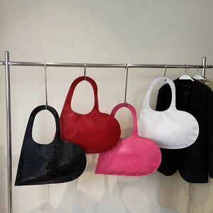 Minimalist heart-shaped tote bags in black, red and white with crocodile texture