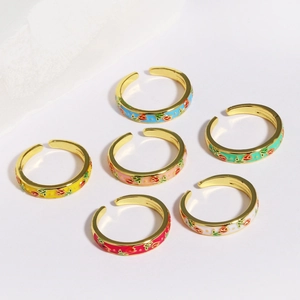 Set of six colorful enamel flower rings in gold finish with adjustable open bands