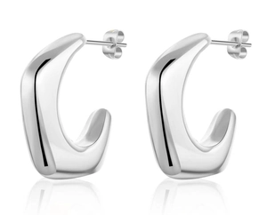 Macro shot of silver C-shaped chunky hoop earrings with high-polish metallic finish