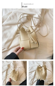 Detailed close-up of khaki woven bucket bag showing drawstring closure and leather texture
