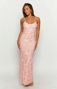 Floral print summer maxi dress with thin straps and slimming fit against white background