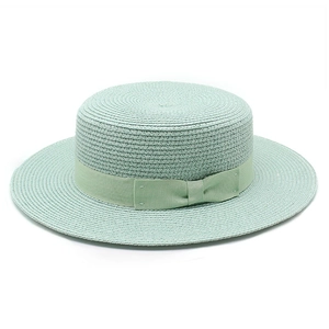 Flat top wide brim mint green straw sun hat with ribbon bow for summer travel