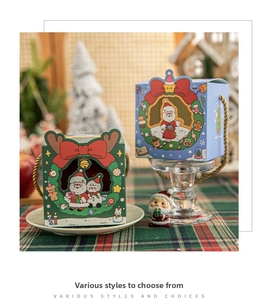Close-up of festive Christmas gift boxes with hollow-out design and gold braided handles