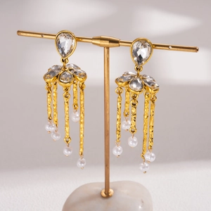 Vintage gold tassel earrings with teardrop crystals and white pearls in luxury design