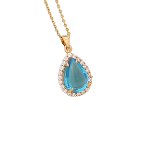 Golden necklace featuring a blue waterdrop gemstone pendant with sparkling crystal halo