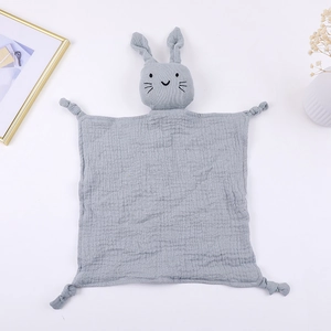 Close-up of grey cotton gauze baby comforter featuring a soft 3D plush rabbit doll head