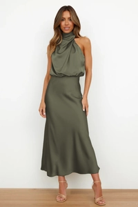 Elegant green satin midi dress with a chic halter neck for sophisticated evening wear