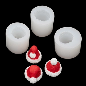 3D Christmas hat silicone molds with finished red resin crafts on black background