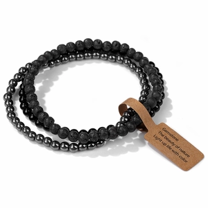 Detail of 4mm natural picture jasper beads with black lava stone and a kraft paper tag