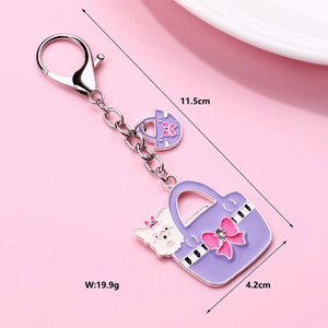Detail view of purple handbag keychain with size 11.5x4.2cm and 19.9g weight display