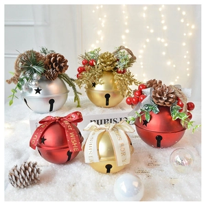 Detailed Christmas bell ornaments with pine cones and berries on a snowy surface