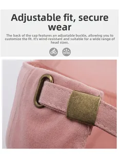 Detail view of pink cotton baseball cap with adjustable retro brass metal buckle strap