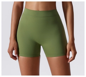 Detailed front view of high-waist olive green yoga shorts in elastic seamless fabric
