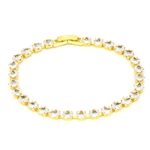 Detailed macro view of 18k gold tennis bracelet featuring square clear zircon stones