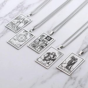 Detail of tarot card pendants including Temperance and Death on silver steel chains
