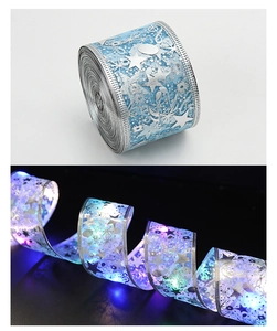 Detail of blue LED ribbon with silver stars and musical notes glowing in the dark