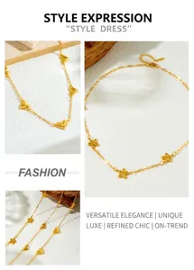 Detail of 18K gold plated necklace featuring heart and flower charms on a thin chain