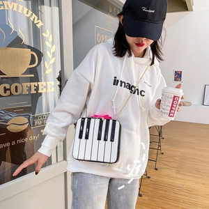Sweet piano keyboard crossbody bag with pink handle and gold chain for women