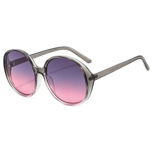 Fashionable oversized round sunglasses with grey transparent frame and purple gradient lenses