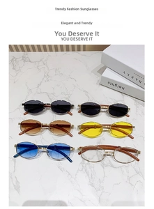 Detailaufnahme der Retro-Sonnenbrille mit Metallsteg und Bügeln in Holzmaserung