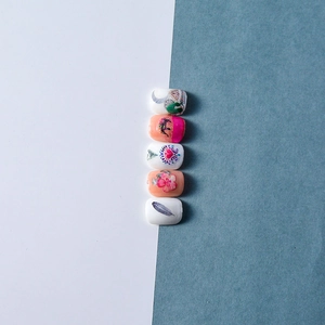 Ethnic 5D nail art stickers with elephant, mandala, and moon motifs on a pink base