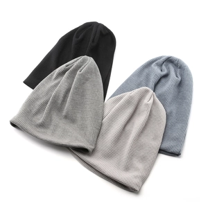 4-pack waffle knit slouchy beanies in black, grey, and blue-grey for winter warmth