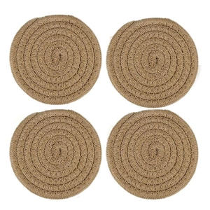 Set of four circular woven jute heat resistant placemats in natural brown texture
