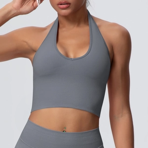 Detailed texture of grey halter neck sports bra with seamless vertical ribbed pattern