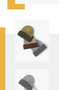 Detail view of thick cable knit beanies in various earth tones with a wide folded cuff