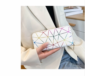 Macro shot of stylish long zipper wallet featuring colorful geometric triangle patterns