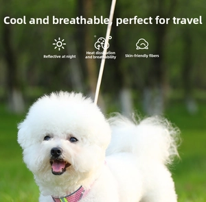 Pink breathable mesh pet harness with reflective strips shown on a Bichon Frise dog