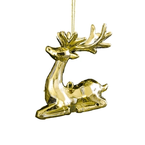 Golden reindeer Christmas ornament with intricate antlers and hanging string on white background