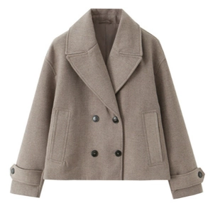 Short double-breasted tan wool coat with wide lapels and buttons on a white background