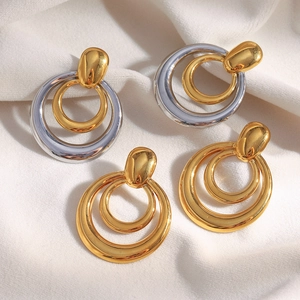 Boucles d'oreilles doubles cercles bicolores or 18K et argent pour femme sur tissu