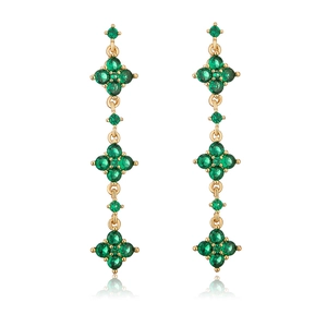 Detail of 18K gold plated tassel earrings with green clover-shaped zircon stones