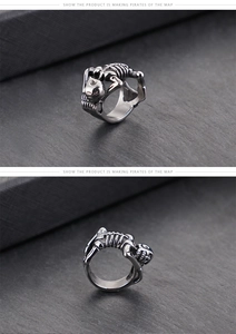 Detailed close-up of gothic skeleton ring with vintage silver finish and punk skull details