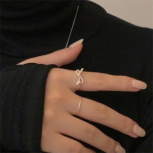 Minimalist S925 sterling silver bow knot ring set worn on model fingers