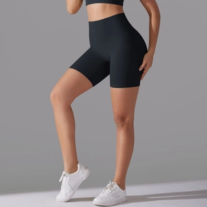 Close-up of high-waist black gym shorts showing seamless fabric and tummy control fit