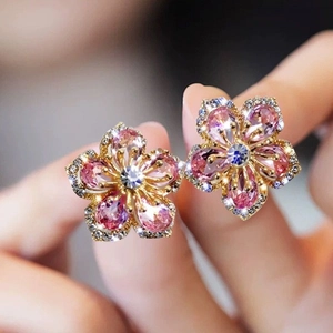 Close-up of pink flower stud earrings with S925 silver needle and sparkling crystals