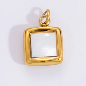 Macro view of a 18k gold-plated square pendant with white mother-of-pearl inlay detail