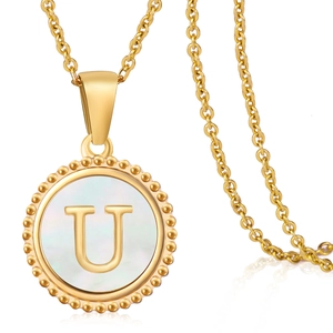 Macro view of 18K gold plated necklace with shell inlay letter U pendant detail