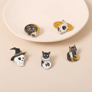 Set of five gothic enamel pins featuring black cat and skull designs for Halloween