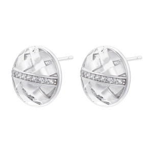 Macro detail of round silver ear studs with woven texture and micro-inlaid zircon
